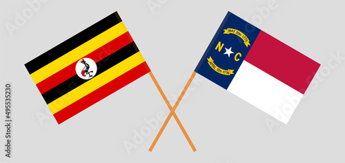 Crossed flags of Uganda and The State of North Carolina. Official colors. Correct proportion photo