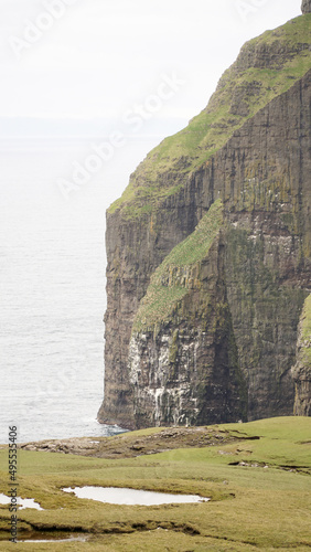 Ásmundarstakkur sea stack located at Suduroy Island in the Faroe Islands. photo