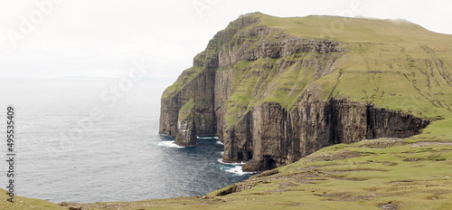 Ásmundarstakkur sea stack located at Suduroy Island in the Faroe Islands. photo