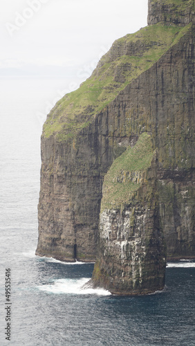 Ásmundarstakkur sea stack located at Suduroy Island in the Faroe Islands. photo