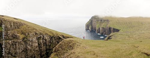 Ásmundarstakkur sea stack located at Suduroy Island in the Faroe Islands. photo