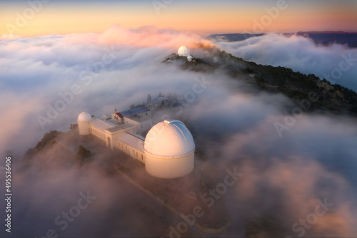 Fog dances around the observatory and the telescopes atop Mt. Hamilton, San Jose, California, USA photo
