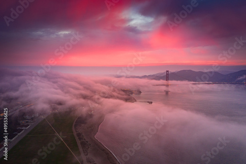 Fog over the a bridge at sunset, San Francisco, California, USA photo