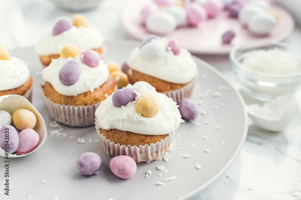 Glazed Easter cupcakes decorated with mini chocolate eggs Glazed Easter cupcakes decorated with mini chocolate eggs