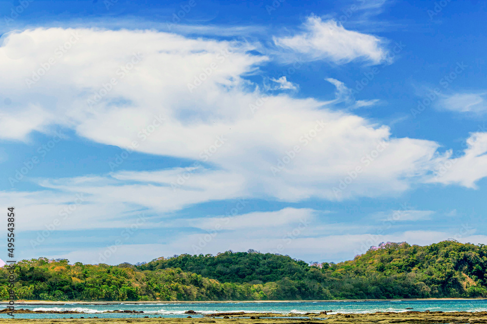 Sea bay surrounded by lush mountains, blue skies and coves. Sea bay surrounded by lush mountains, blue skies and coves.