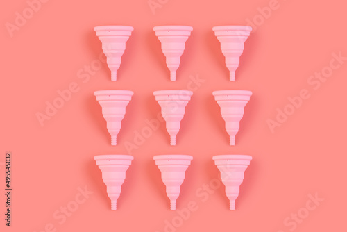 Menstrual pink cups pattern on a pink background. Monochrome zero waste concept. eco-friendly, Alternative reusable product for female hygiene.
