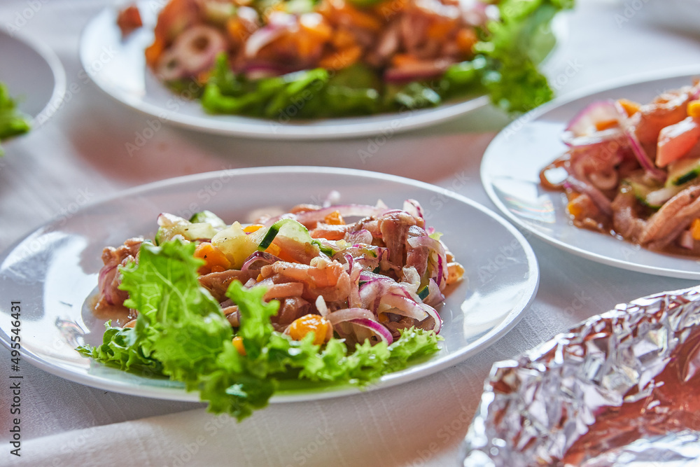 Traditionally made Mexican ceviche. Fish strips with tomato, lettuce, onion, avocado, orange. Traditionally made Mexican ceviche. Fish strips with tomato, lettuce, onion, avocado, orange.