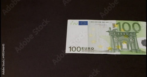 One hundred US Dollar and 100 Euro banknotes. European currency and US currency