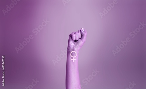 Purple hand of a woman for international women's day and the feminist movement. Activism for women rights