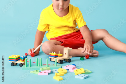 Cute little boy playing wit...