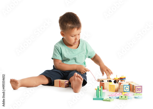 Cute little boy playing wit...