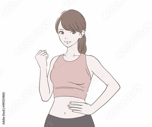 ガッツポーズをするスポーツインストラクターの女性