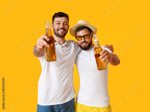 Young men with bottles of b...