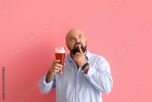 Thoughtful bald man with be...