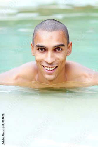 I love the water. Portrait of a handsome young man in a swimming pool. © Thomas T/peopleimages.com
