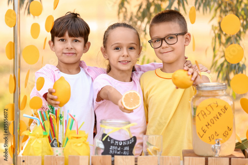 Cute children selling lemon...