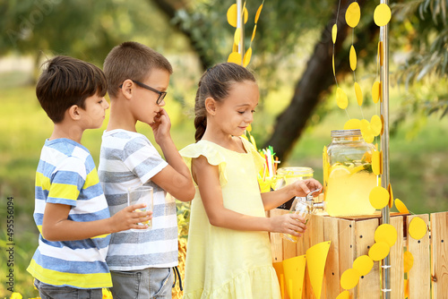 Cute children buying lemona...