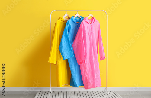 Rack with colorful raincoat...