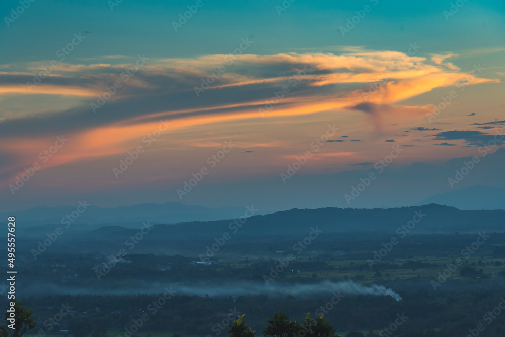 Blue golden sky sunrise dramatic beautiful landscape mountain. Dawn sky gold dusk time cloudscape with sunlight. Dramatic sunset over mountain landscape. Beautiful landscape foggy hills twilight time