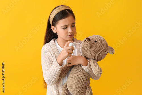 Little girl with toy and sp...