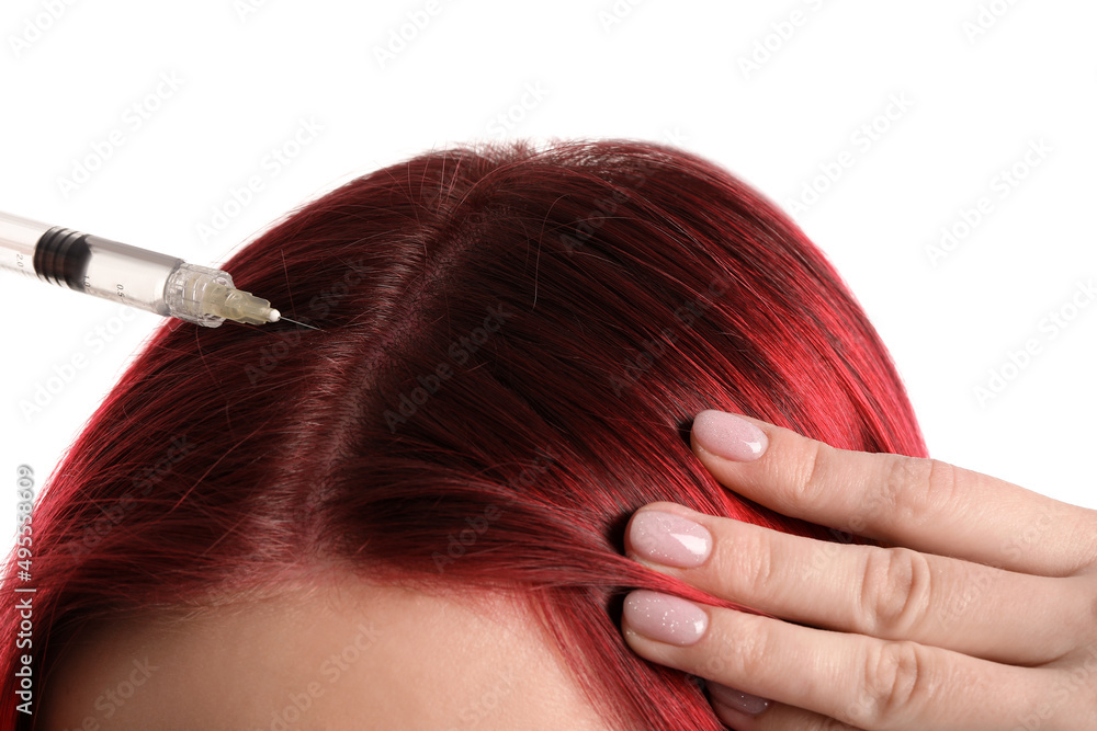 Young woman with hair loss problem giving herself injection on white background, closeup Young woman with hair loss problem giving herself injection on white background, closeup