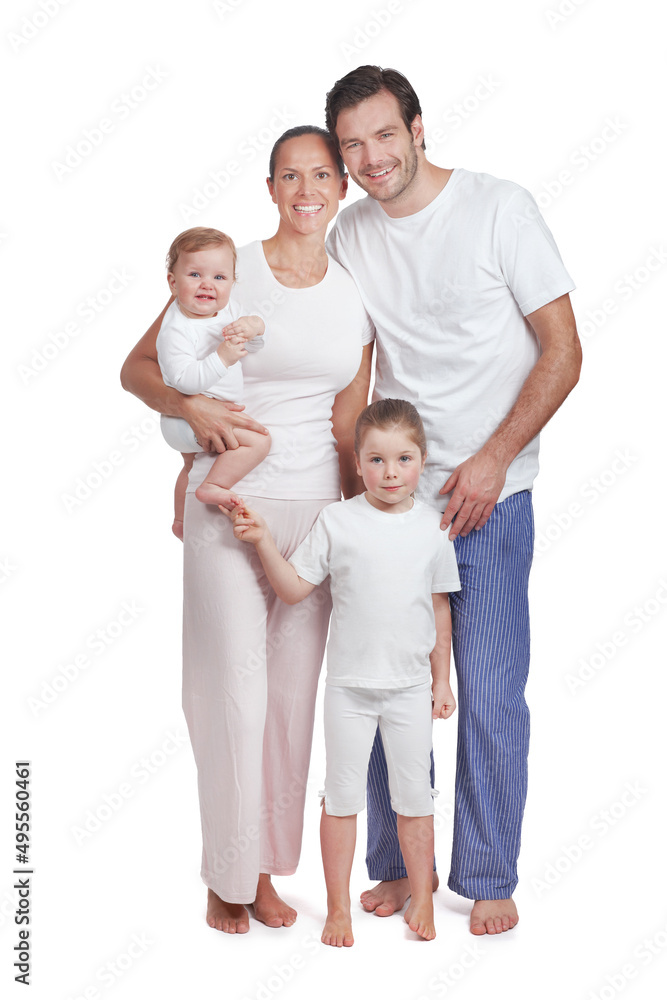 Close-knit family of four. Studio portrait of a family with two children dressed in casual wear.