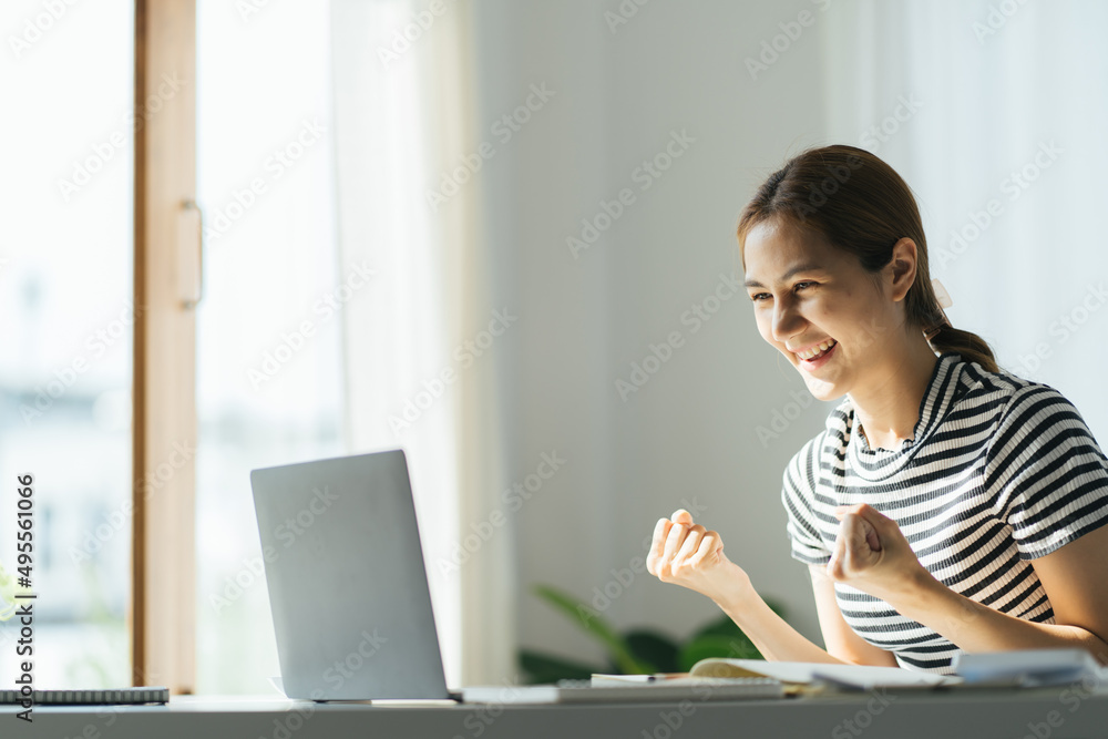 Portrait of young Happy excited asian businesswoman in office working with computer laptop,Yes great job. Portrait of young Happy excited asian businesswoman in office working with computer laptop,Yes great job.