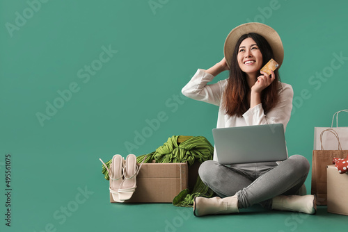 Happy young woman with lapt...