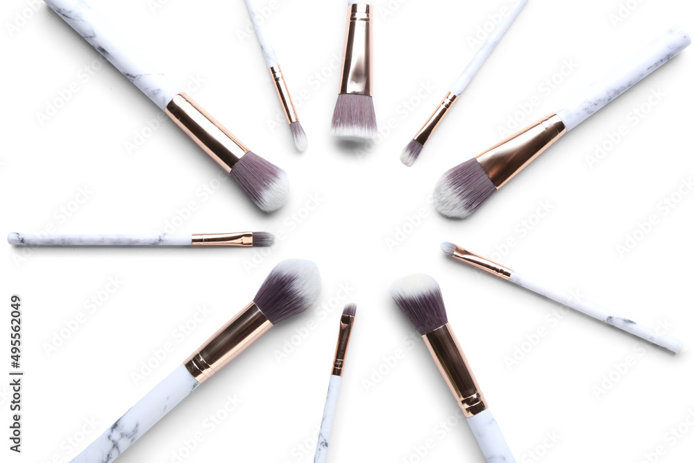 Composition with set of makeup brushes isolated on white Composition with set of makeup brushes isolated on white