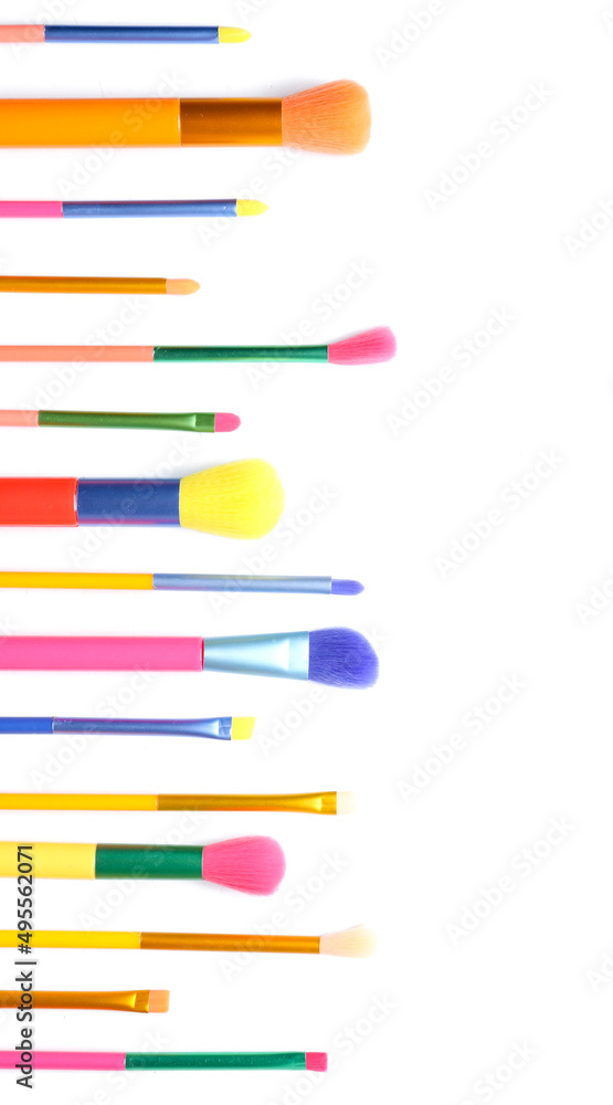 Set of colorful makeup brushes isolated on white, top view Set of colorful makeup brushes isolated on white, top view