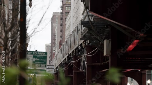 CTA Subway train passing on Elevated Track in the Loop of Chicago, seen from below on Street, Sidewalk Level