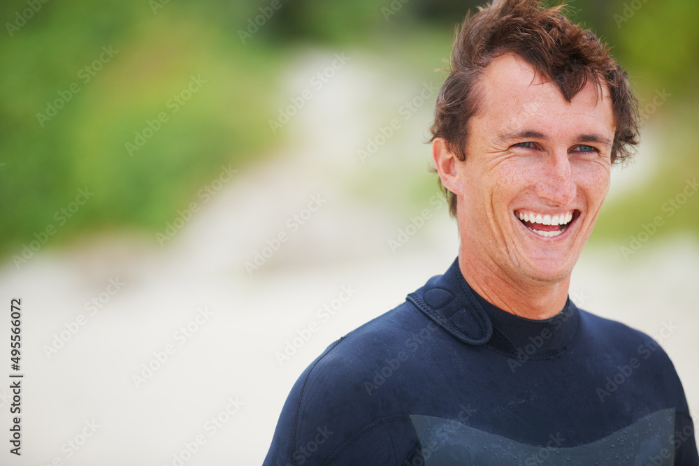 Surfing is my happy space. Shot of a handsome young surfer. Surfing is my happy space. Shot of a handsome young surfer.