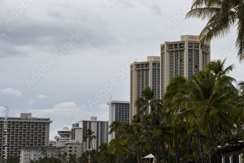 Turquoise waves wash ashore on Waikiki Beach in Honolulu, Hawaii