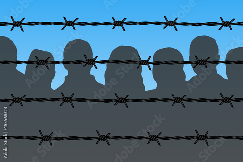 Dark people silhouettes behind barbed wire fencing