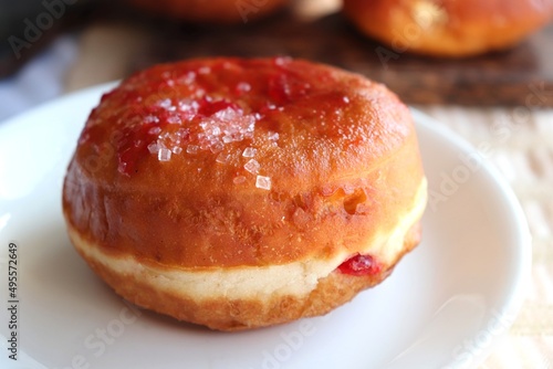 Cream filled jam donuts. garnished with sugar crystals. Traditional German Polish Donut with Raspberry Jam Dusted with Sugar.