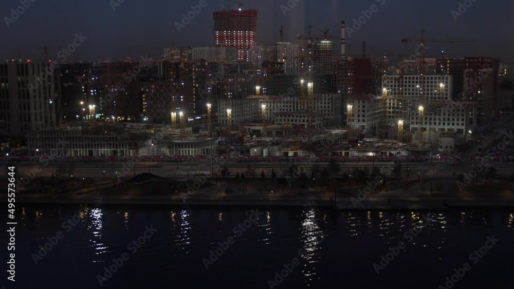 Construction International Business Center City at night with Moscow river, Moscow, Russia. Construction International Business Center City at night with Moscow river, Moscow, Russia.
