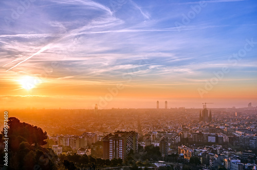 The skyline of Barcelona in Spain at a misty sunrise