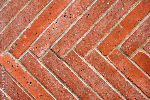 Background from a wall made of diagonal red clinker bricks