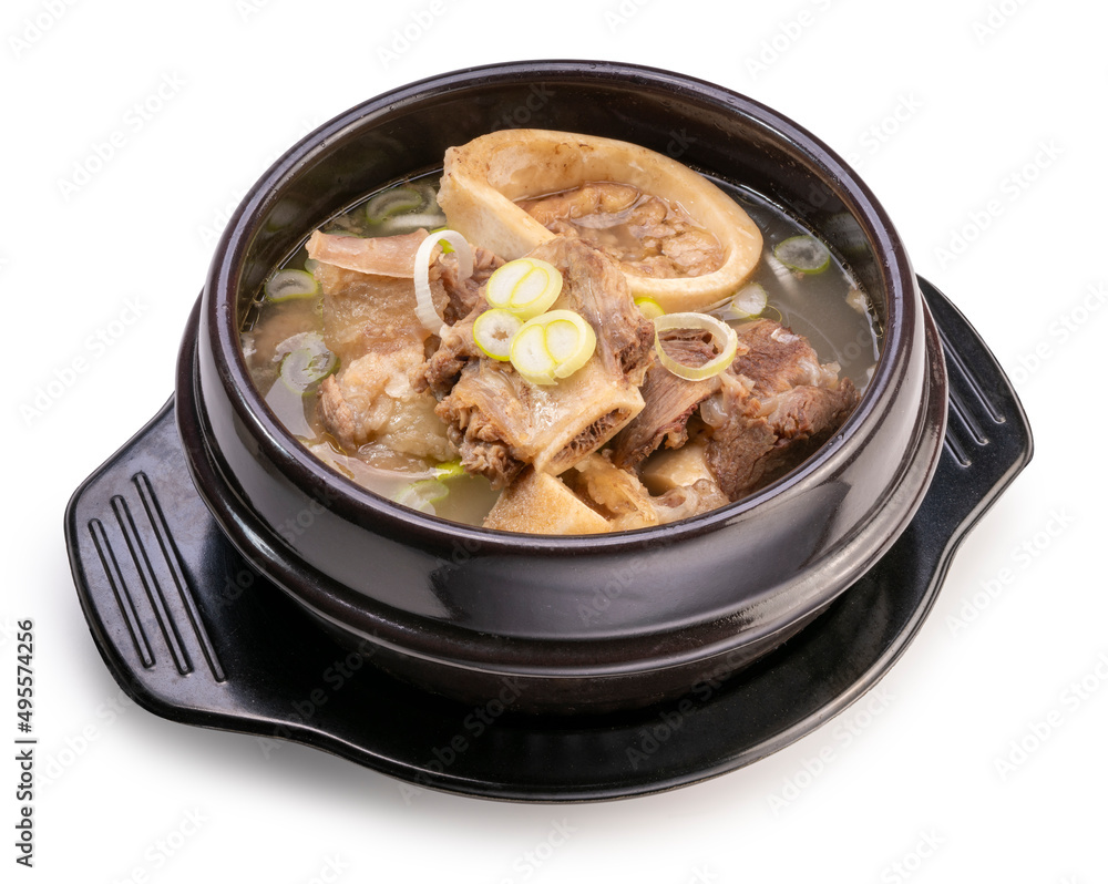 Beef bone marrow soup in hot iron pot isolated on white background, Beef Stock Bone soup or Seolleongtang in iron pot on white With clipping path. Beef bone marrow soup in hot iron pot isolated on white background, Beef Stock Bone soup or Seolleongtang in iron pot on white With clipping path.