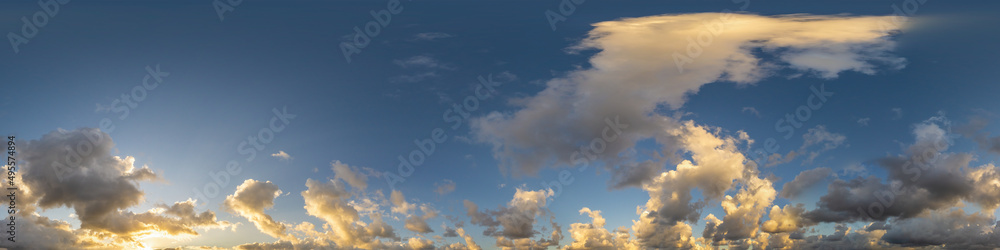 Dark blue sunset sky panorama with Cumulus clouds. Seamless hdr pano in spherical equirectangular format. Complete zenith for 3D visualization, game and sky replacement for aerial drone 360 panoramas.