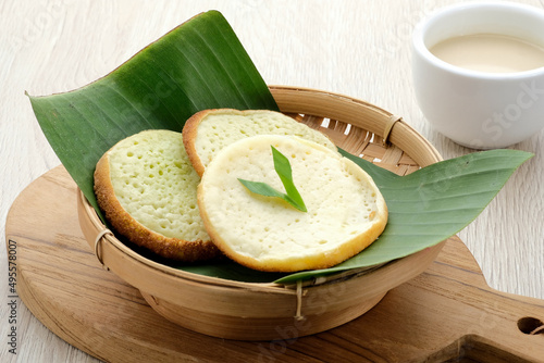 Serabi or Surabi,  Indonesian pancake made of flour, rice flour and coconut milk. Served with palm sugar sauce. Sweet and savory. 
 photo