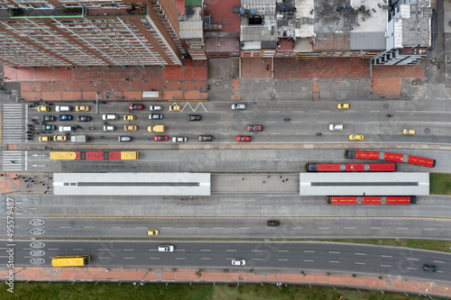 Aerial view of an avenue with vehicular traffic and a public bus station in the city of Bogota. Colombia.