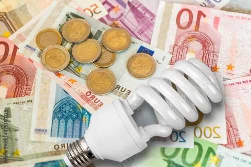 Energy Saving concept. Energy costs and electricity prices. Electricity consumption concept. Euro Banknotes with lamp