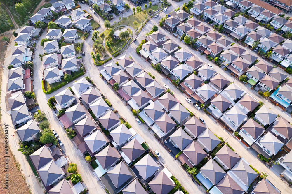 New development real estate. Aerial view of residential houses and driveways neighborhood during a fall sunset or sunrise time.Tightly packed homes.Top down view over private houses in phuket thailand New development real estate. Aerial view of residential houses and driveways neighborhood during a fall sunset or sunrise time.Tightly packed homes.Top down view over private houses in phuket thailand