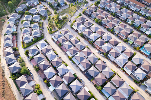 New development real estate. Aerial view of residential houses and driveways neighborhood during a fall sunset or sunrise time.Tightly packed homes.Top down view over private houses in phuket thailand