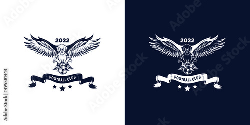 An eagle angry animal sports mascot holding an football or soccer logo
