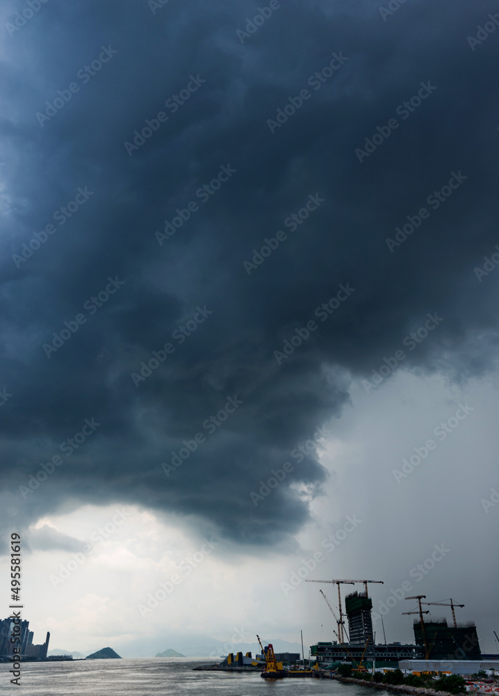 Fototapeta premium Hong Kong downtown with dark clouds in storm