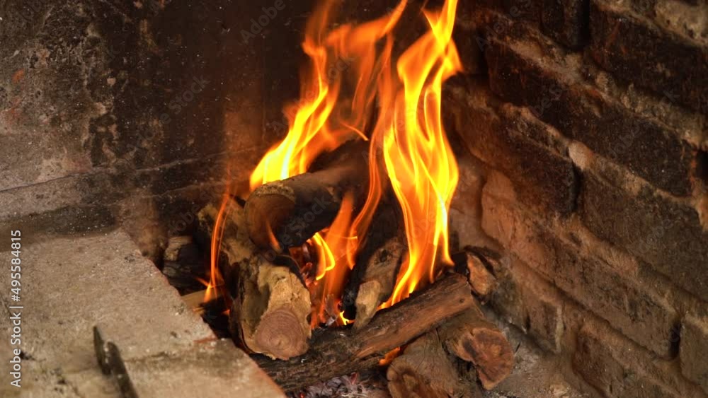 Large flaming fire with logs burning in slow motion Large flaming fire with logs burning in slow motion