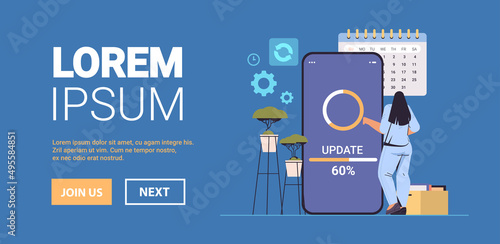 woman updating operating system update process install new software on smartphone horizontal