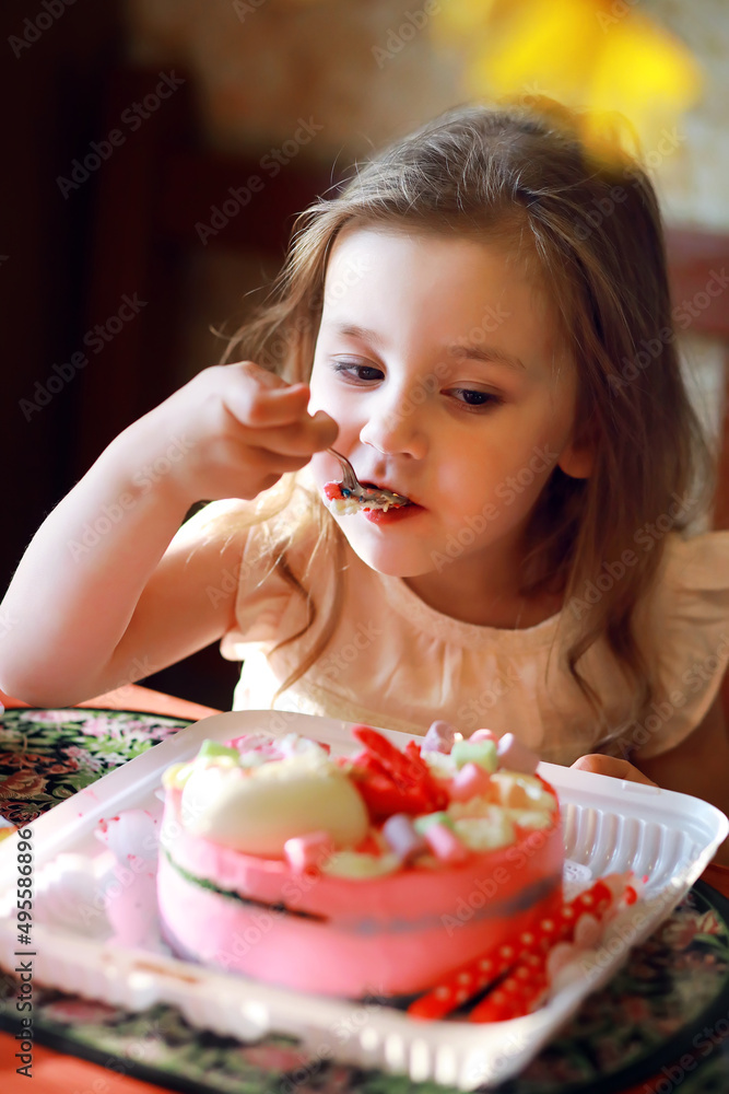 Children in party caps celebrating birthday with cake and balloons at home. Children in party caps celebrating birthday with cake and balloons at home.